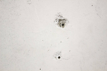 混凝土墙上的弹孔,纹理,背景照片