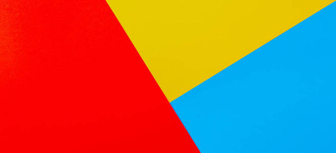 黄色调彩色纸几何平面构图背景黄,红,蓝色调照片