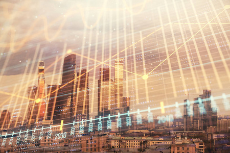 商业区背景下的金融图表双重曝光.股票市场研究与分析的概念照片