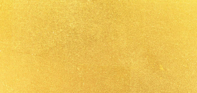 拉丝棕色表面金色金属拉丝背景照片