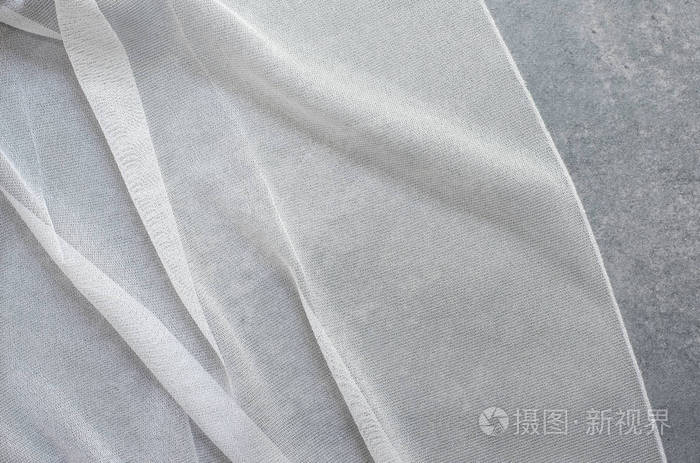 美丽薄纱的特写镜头.透明窗帘面料样品.纹理,背景,图案.室内设计.蕾丝