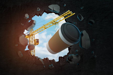 吊起吊车提着咖啡纸杯冲破黑墙,洞内留洞,洞内蓝天.照片