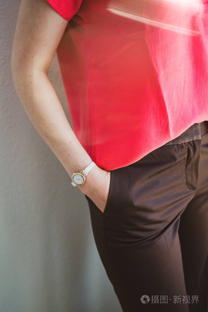 elegant woman hands in pockets