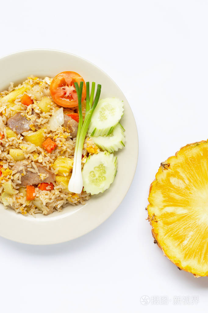 pineapple fried rice with fresh pineapple slice on white