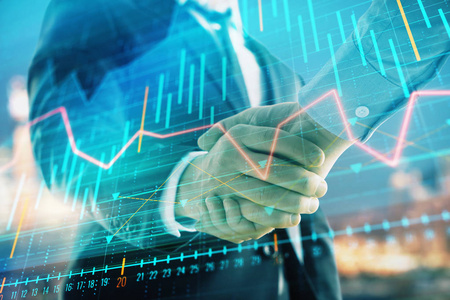 两位商人握手的城市景观背景下的金融图表双曝光.