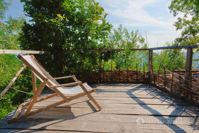 Old Wooden Armchair on Balcony 