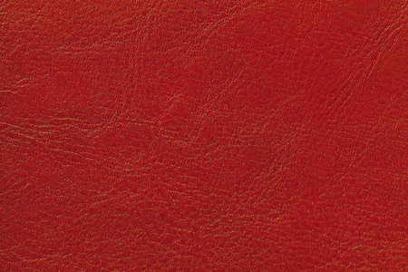 深红色皮革纹理背景,特写.从起皱的皮肤上看,背景砖开裂了.照片