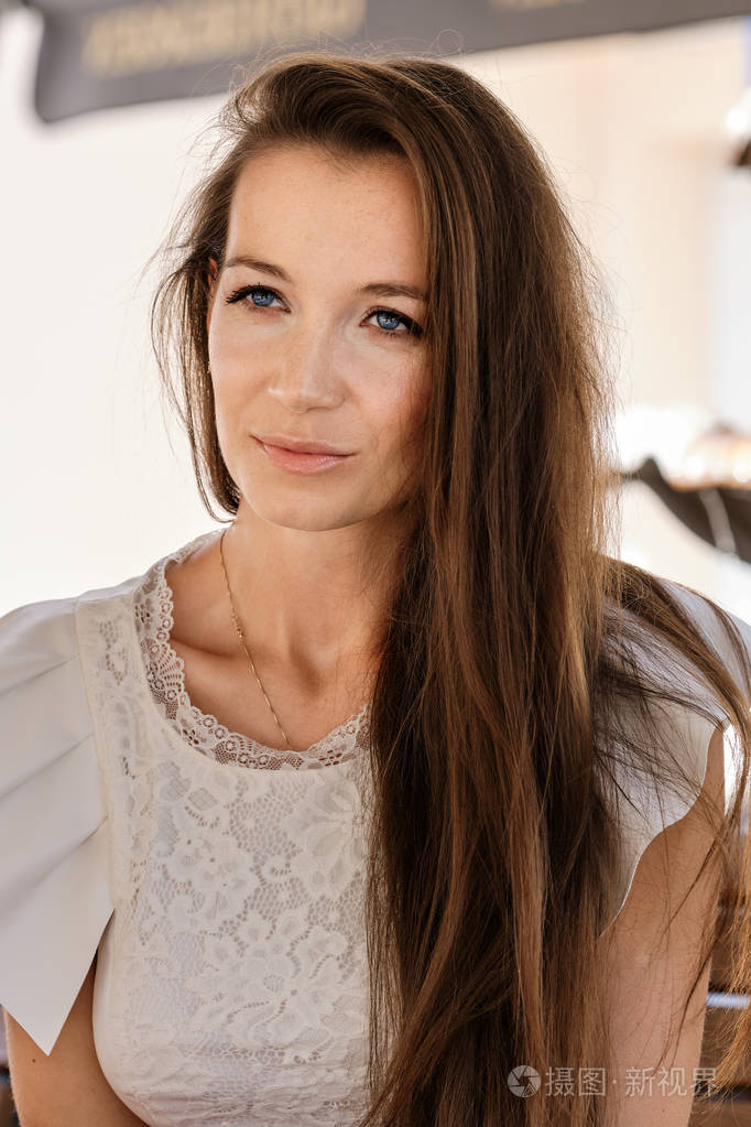 Closeup portrait of woman with freckles without makeup 