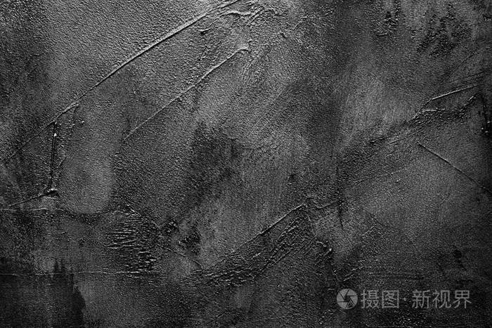 破旧的深灰色墙壁深色背景带油灰纹理
