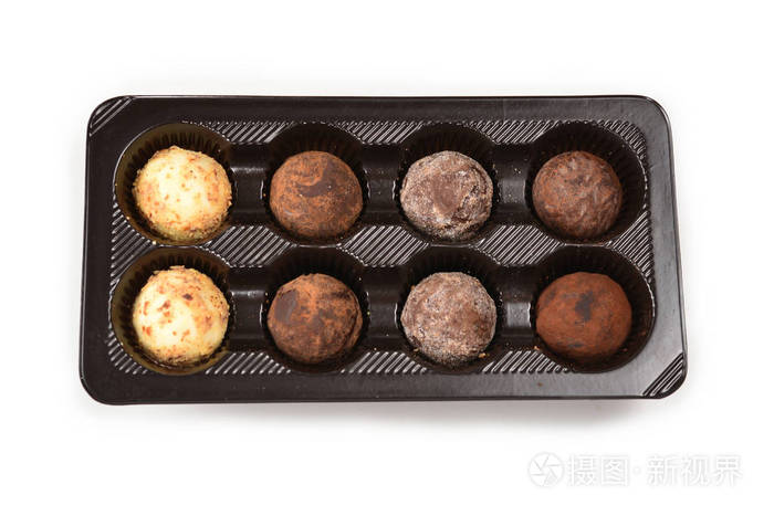 Chocolate candy collection in plastic box. 