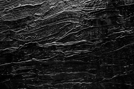黑色岩石纹理板的抽象背景摄影图