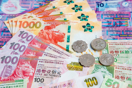 hongkong dollar money banknote with coins 照片