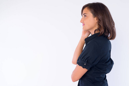 手托下巴思考的美女侧面图穿着礼服的美女仰望墙壁的