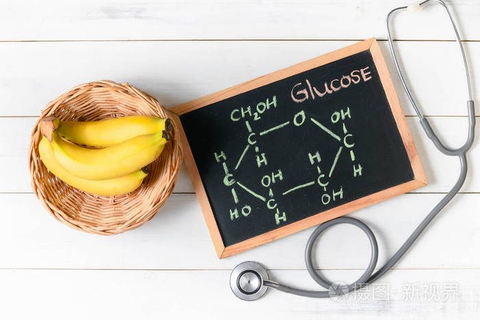 glucosemoleculeonblackboardwithbananaandstethoscope
