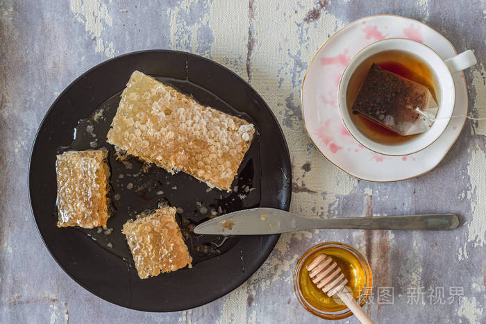 Top view of cup of red tea with honey 