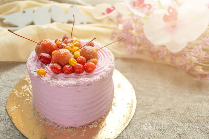 Pink cake on pastel background. Piece of biscuit patterned cake 