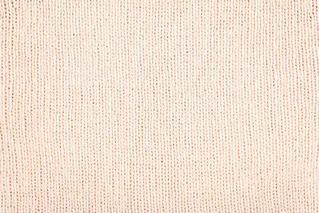 粉红色浅色针织面料背景.针织毛织物玫瑰色照片