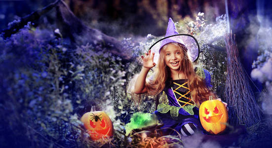 wide poster for kids halloween party with a girl witch 照片