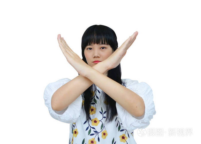 可爱的亚洲女孩交叉手拒绝