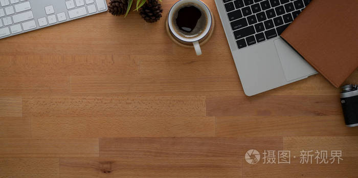 Workplace with laptop and  supplies on wooden table 