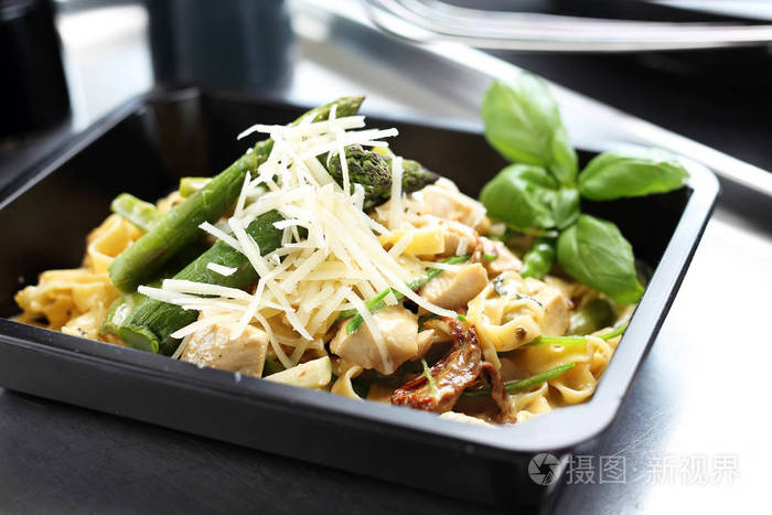 Pasta with asparagus. Takeout dish. Lunch box. 