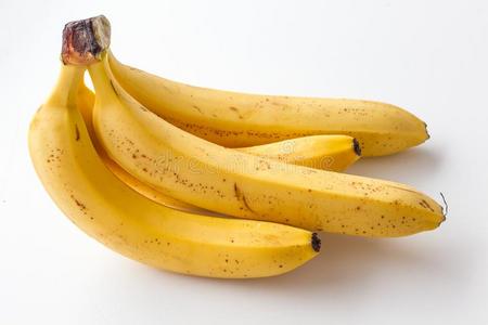 黄色的成熟的香蕉向一白色的b一ckground.