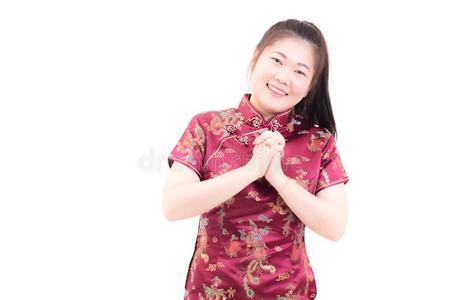 年幼的亚洲人女人使人疲乏的中国人衣服传统的旗袍winter冬天