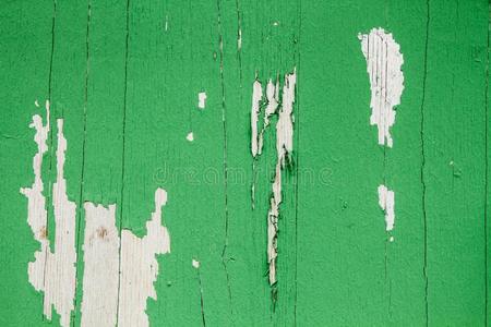 老的蹩脚的和风化的绿色的描画的木制的墙木板质地