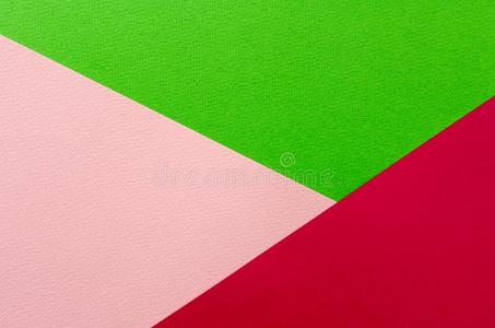 有色的几何学的粉红色的和绿色的纸质地背景.