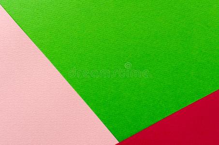 有色的几何学的粉红色的和绿色的纸质地背景.