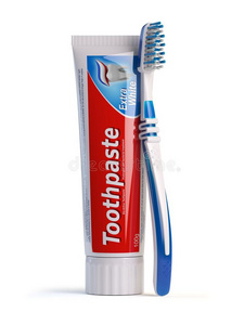 牙刷和管关于牙膏隔离的向白色的背景