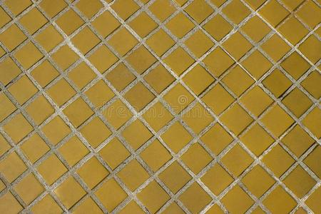 黄色的正方形瓦片地面背景或质地.