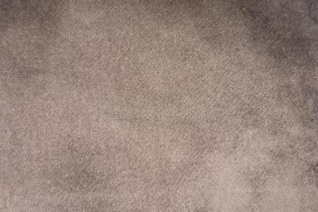 光灰色绒面革织物特写镜头.丝绒质地背景.照片