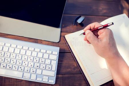 做记录商人工厂和便携式电脑和做记录采用笔记簿胜过照片