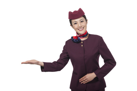 鞠躬礼仪棚拍年轻女服务员做手势照片