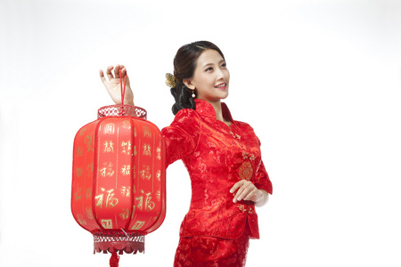 中国女人的灯笼棚拍身穿旗袍的年轻女人提着红灯笼照片
