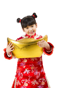 棚拍中国新年唐装儿童抱着金元宝照片