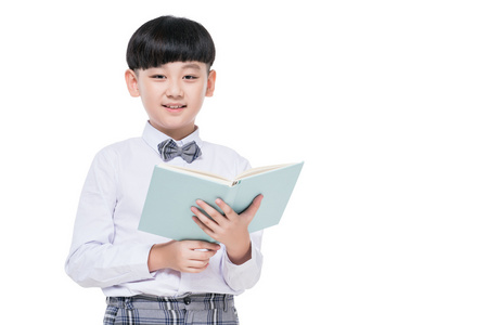 快乐的小学生手拿课本照片