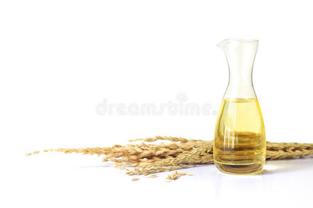 未碾磨稻糠油采用瓶子玻璃和未碾磨稻照片