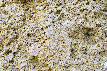 软质石灰石的一种自然的能穿透的石头.建筑物材料照片