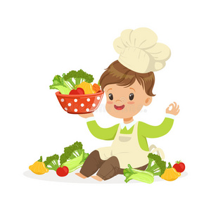 漂亮的小的男孩厨师烹饪术新鲜的蔬菜,小孩健康的食物照片