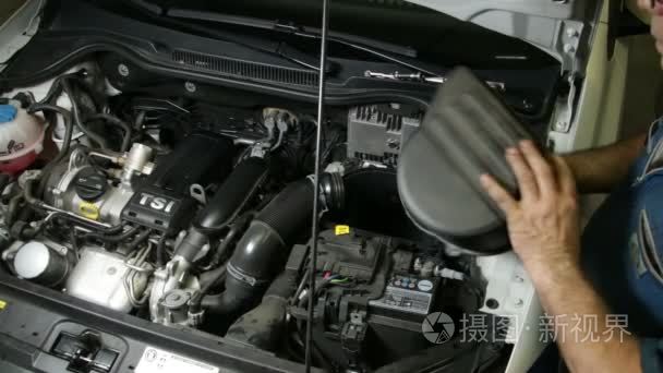 Car Repair Mechanic Assembles Automobile Air Filter