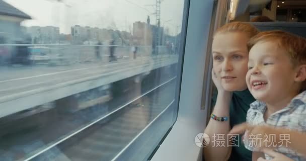 Mother and son traveling across the city by train