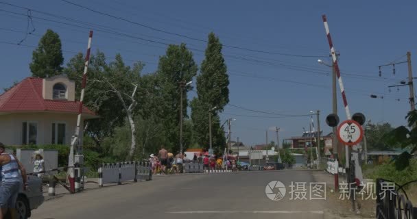 Asphalted Road Railroad Crossing  People Go by Road  Railway Wor