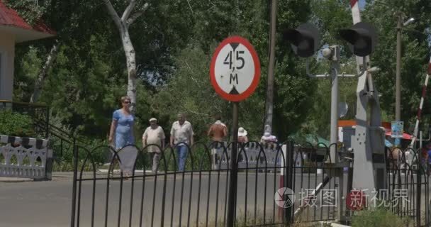 People Group of Children Are Passing Through The Railroad People