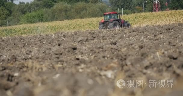 Tractor is Plowing The Soil of Field Soil Close Up Tractor is Fa