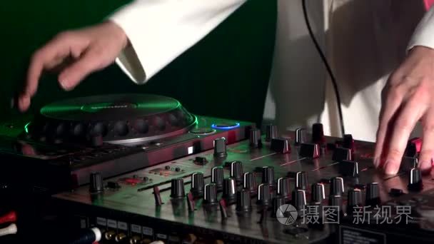 Dj hands on stylish equipment deck  dancing and playing  close u