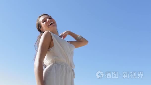 woman enjoying a summer day and smiling