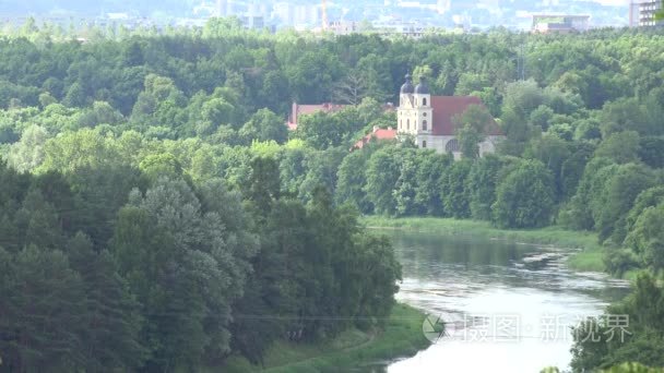 zoom out of wonderful views of monastery and the green forest. 4