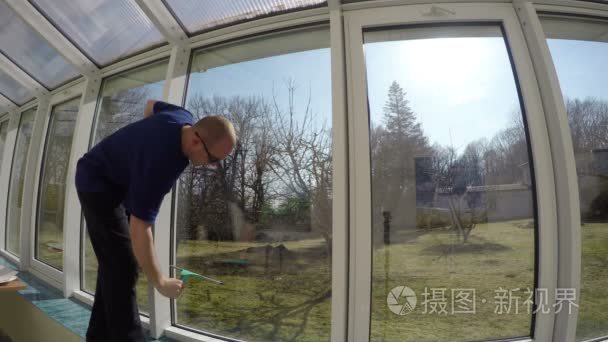 Washing greenhouse windows in spring. 4K